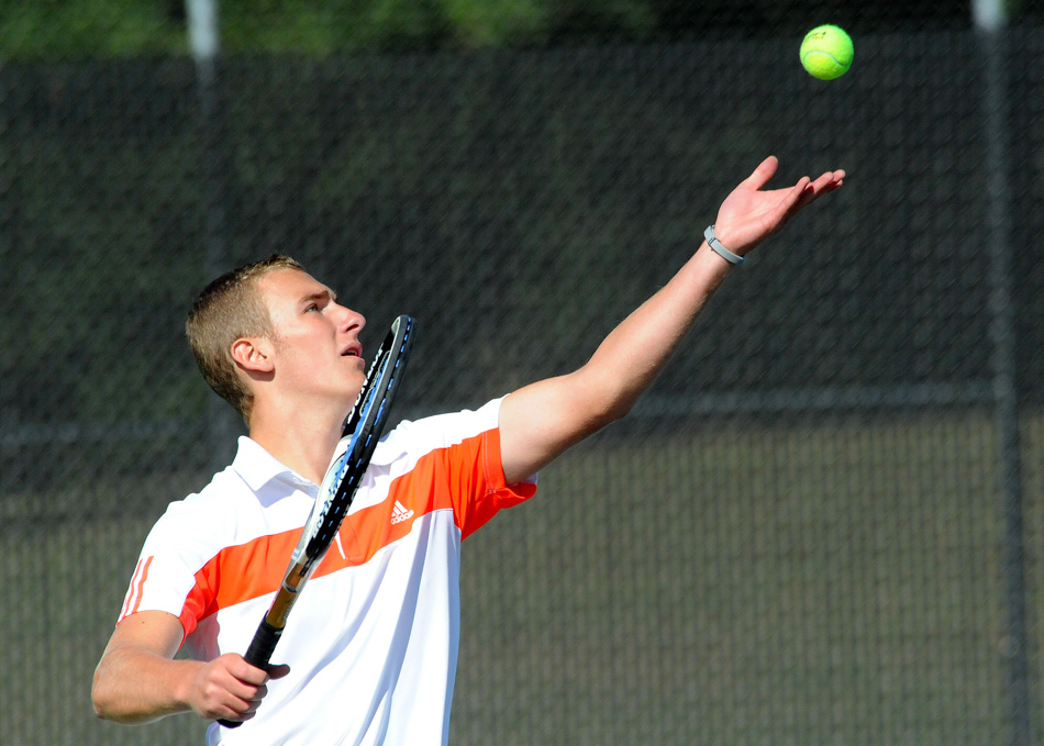 Hudson Snyder serves during play at the Warsaw Tennis Invite Saturday. The Tigers finished seventh as a team among a field with four state-ranked teams. (Photos by Mike Deak)