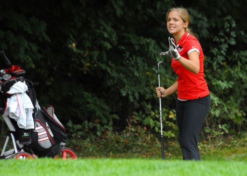 NorthWood's Mackenzie Weaver tries to coax a chip shot into the hole during her career round of 77.