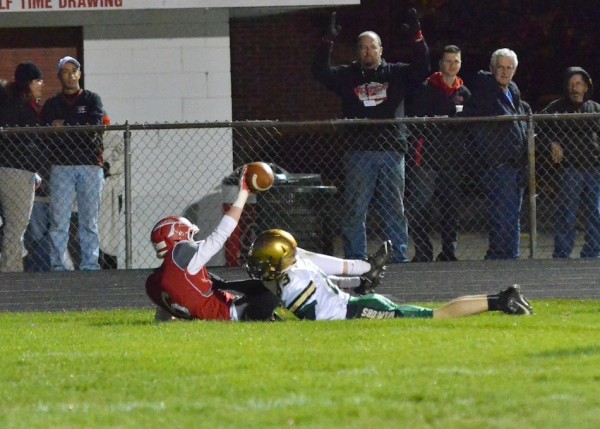Corbin Harrison shows that he completed the catch for Goshen's second score of the night. 
