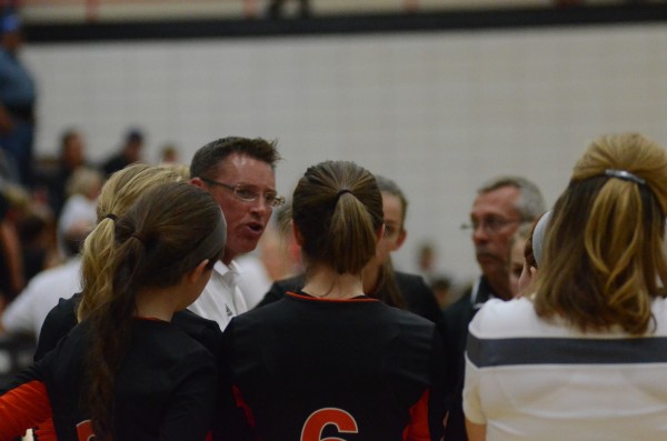 Animated Warsaw volleyball coach Mike Howard makes a point to his team Thursday night.
