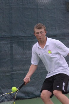 Colton Lind reaches for a shot in his No. 2 singles match.
