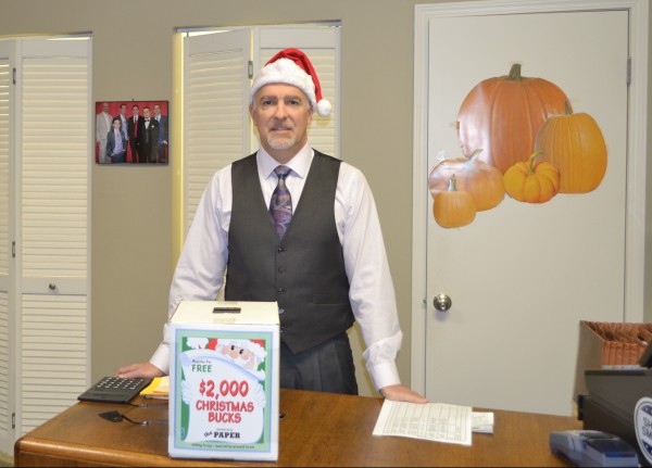 Tim Hamann, owner of Male Fashions in Warsaw, is ready for the Christmas Bucks promotion to begin. The promotion runs four consecutive weeks from Oct. 28 to Nov. 18.