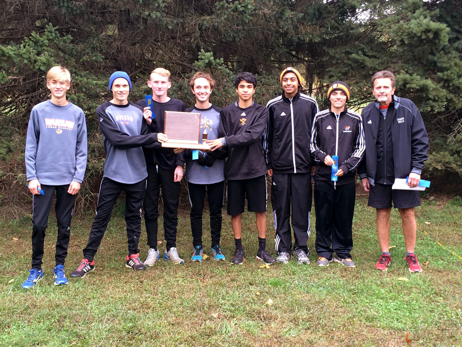 The Warsaw Tigers are the 2015 Northern Lakes Conference boys cross country champions.