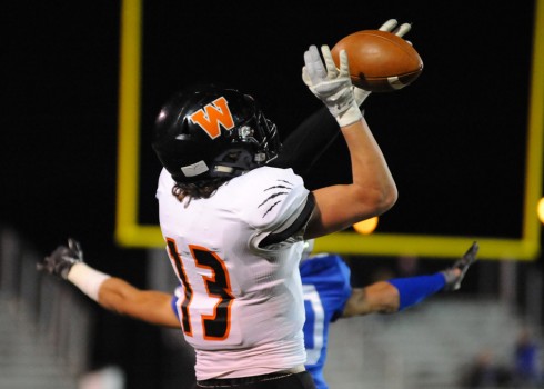 Warsaw receiver Brock Riley hauls in a pass.