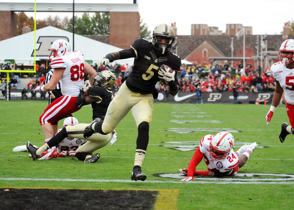 Purdue's Dominique Young scores from four yards out as Purdue upset Nebraska SCORE Saturday. (Photos by Mike Deak)