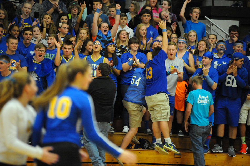 Triton's student section celebrates early on at the Triton Volleyball Regional.