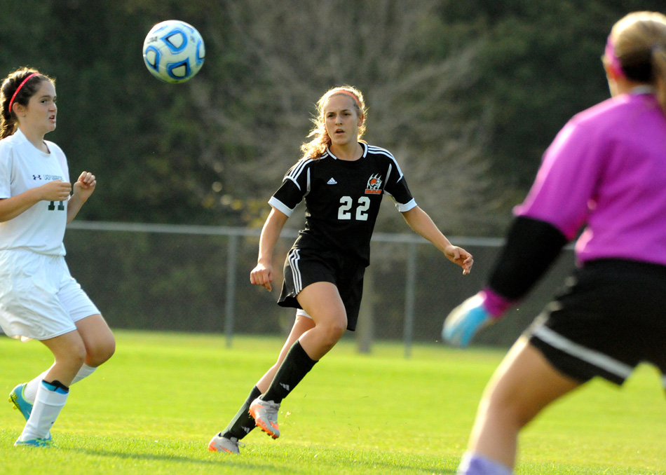 Warsaw's Dayle Harvey sends in a lofting cross against Wawasee Thursday evening at the Plymouth Girls Soccer Sectional. Warsaw won the match 8-0 to advance to Saturday's final. (Photos by Mike Deak)