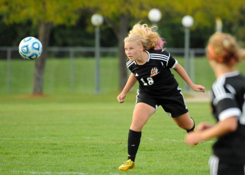 Warsaw defender Breck Jackson heads a ball to safety as part of the eighth shutout the defense has pitched this season.