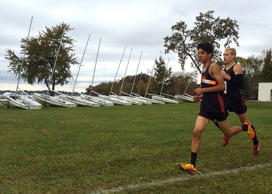 Warsaw's Zeb Hernandez and Owen Glogovsky make their way into the first straightaway of the Culver Academy Boys Cross Country Regional Saturday morning. Glogovsky and Hernandez would finish second and third, respectively, and the Tigers would go on to win the team title. (Photos by Mike Deak)