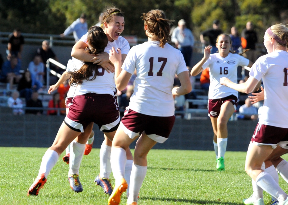 Culver Academy's Natasha Wanless (center) celebrates after scoring the winning penalty kick to lift her team to a sectional championship over Warsaw Saturday afternoon at the Plymouth Girls Soccer Sectional. (Photos by Mike Deak)
