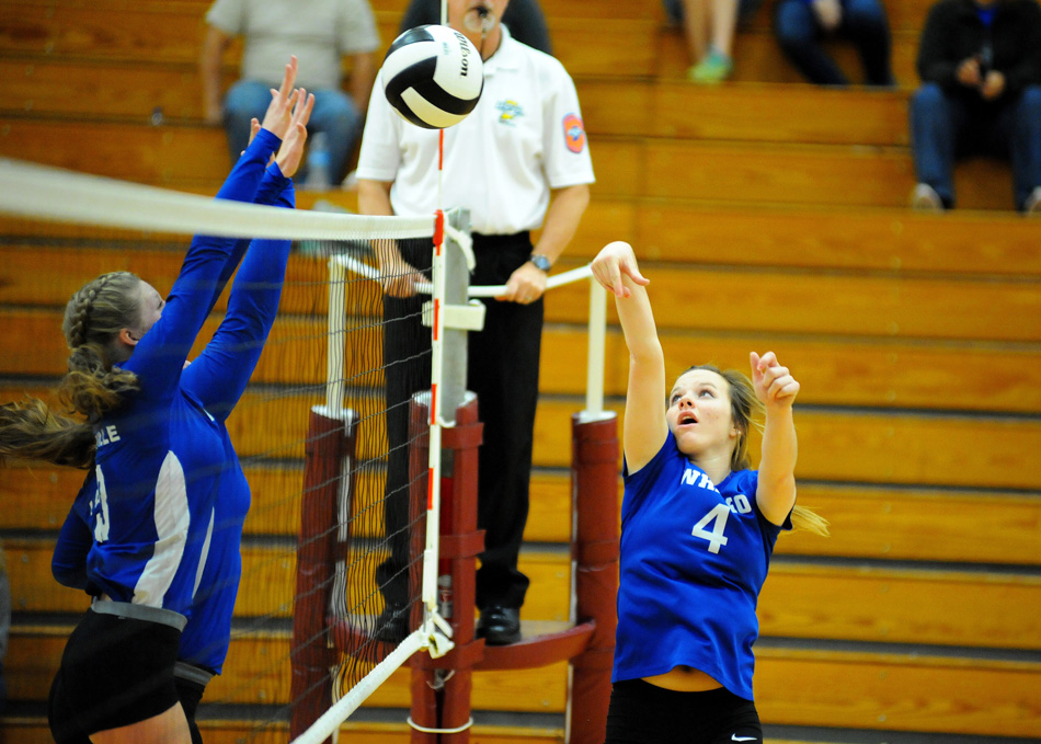 Whitko's Haley Yohe tries to get a tip around two LaVille blockers during the Lady Wildcats' 3-1 win Thursday in the Central Noble Volleyball Sectional. (Photos by Mike Deak)