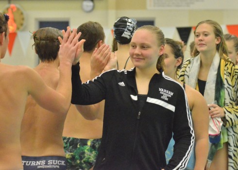 Brenna Morgan leads the team in congratulating Wawasee on a good meet following the two team's meeting on Saturday. (Photos by Nick Goralczyk)