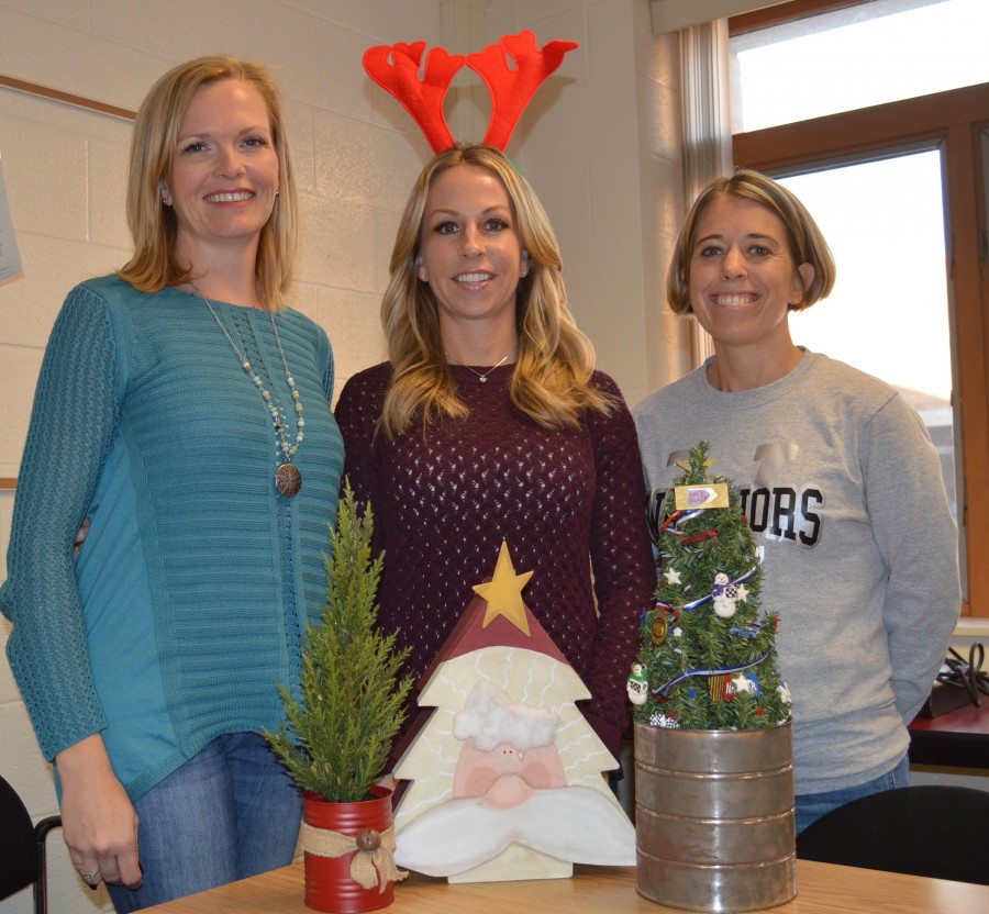 From left, Susan Cripe, Shauna Young and Kristen Firestone are among those helping to plan and organize the annual Wawasee Middle School Craft Bazaar. In front of the three women are a few items typically found at the bazaar.