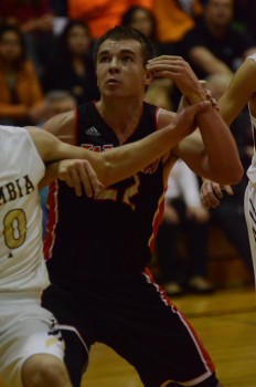 Jaceb Burish battles for position for the Tigers. The junior played a big role in Warsaw's win Saturday night.