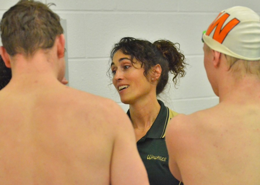 Wawasee head coach Julie Robinson talks with some of the Warsaw swimmers following meet. One can hope there was serious trash talk being exchanged, but it seems unlikely. 