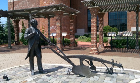 An outdoor exhibit in front of the Oliver smokestack tells the story of his chilled plow.