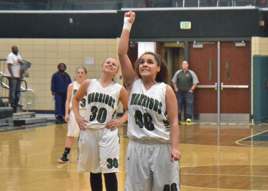 Kylee Rostochak (30) and Seaquinn Bright (40) cringe as they watch Bright's fre throw rattle around the rim late in Thursday's game against Marian. (Photos by Nick Goralczyk)