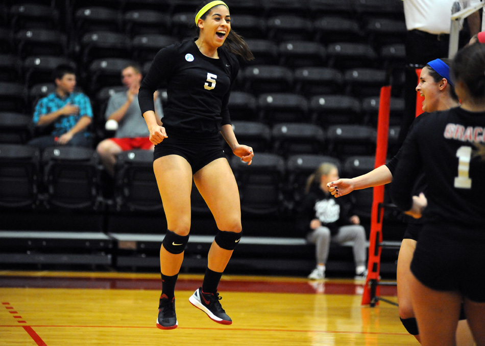 Annie Salazar of Grace reacts after a point in the first game of a 3-0 sweep of Bethel College in the first round of the Crossroads League volleyball tournament Saturday night at Grace. (Photos by Mike Deak)