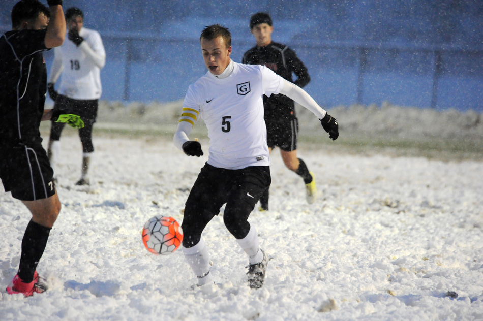 Grace's Kyle Hamlin navigates the snowy tundra Saturday evening against Roberts Wesleyan in the NCCAA Midwest Regional men's soccer championships match, won by Grace 2-0. (Photos by Mike Deak)
