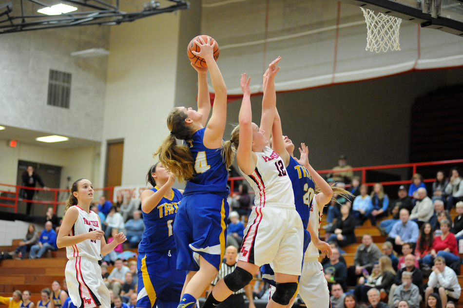 Triton's Charlotte Morris pulls down an offensive rebound against NorthWood Tuesday night. (Photos by Mike Deak)