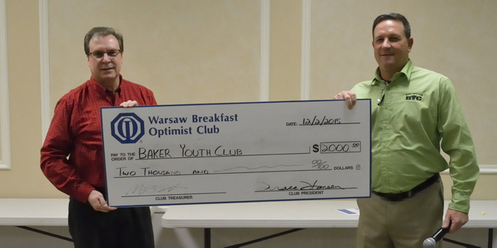 From left are Mitch Goon representing The Warsaw Breakfast Optimist Club, and Tracy Furnival representing Baker Youth Club.