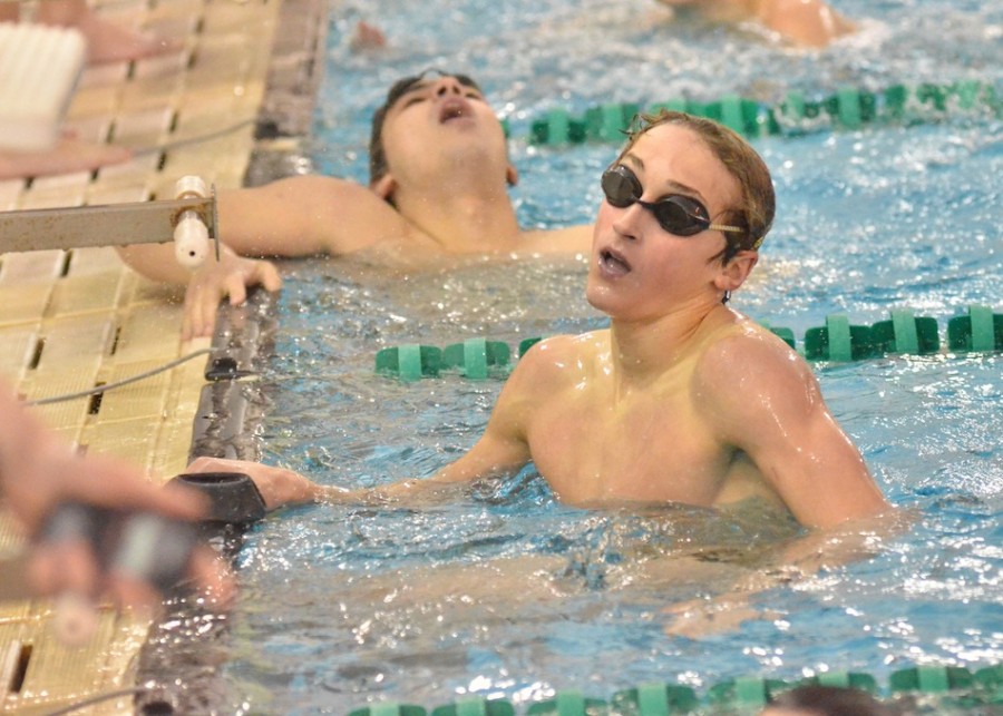 Brady Robinson (right) checks out his time after winning the 200 IM while St. Joe's Tim Greci shows some disappointment with his finish. (Photos by Nick Goralczyk)