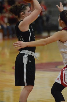 Aubrey Kuhn protects the ball for Wawasee.