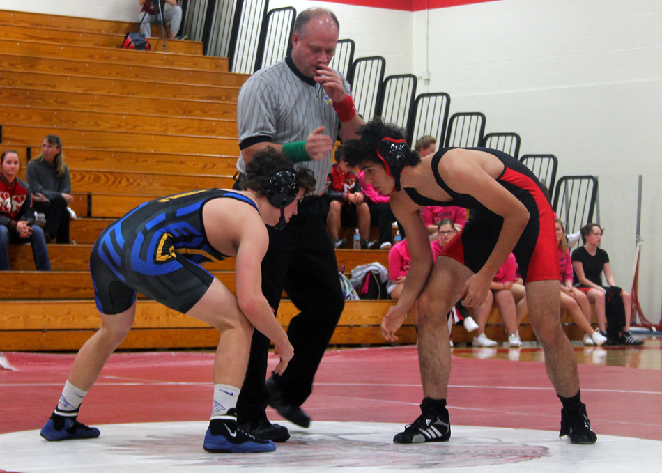 Triton's Gage Waddle, left, and North Miami's Pablo Bengoa square off in the 170-pound bout Tuesday night. (Photo provided)