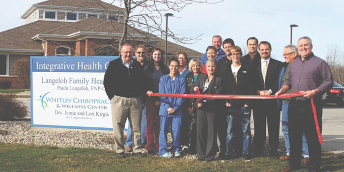 Those present for the ribbon cutting ceremony from left, are, Randy Holler of Crossroads Bank, Lee Aumsbaugh of Aumsbaugh Flooring, Allissa Peterson, Dallas Kirgis, Cathy Erne, Ruby Brower, Paula Langeloh of Langeloh Family Healthcare, Jane Langeloh, Tim Brower, Brooks Langeloh, Hunter Langeloh, Don Clemens of Rabb Water Systems, Don Mockler of Edward Jones Investments, Jay MacIntosh and Doug Brown of the Whitley County Chamber of Commerce. (Photo provided)