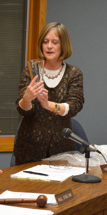  Syracuse Clerk Treasurer Julie Kline reads the inscription on a glass vase she received from the Syracuse Town Council as a thank you gift for her years of service during the Syracuse Town Council meeting Tuesday, Dec. 15. Kline is retiring at the end of the year.