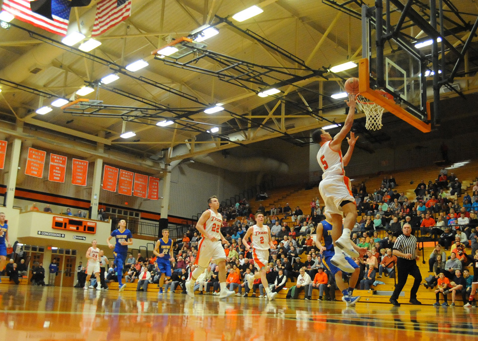 Warsaw's Jeremy David soars in for a layup in the Tigers' 65-32 win Tuesday night. (Photos by Mike Deak)