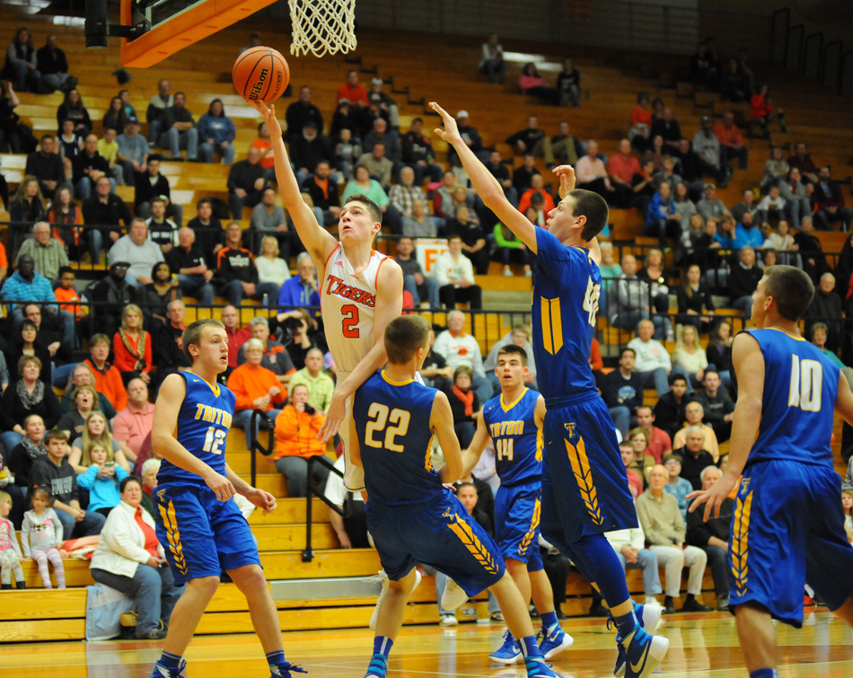 Kyle Mangas is having a stellar season for the undefeated Warsaw boys basketball team (File photos by Mike Deak)