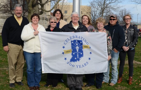 Celebrating the state's bicentennial by participating in the raising of the bicentennial flag are shown above. In front, from left, are Deb Wright and Jean Weller, committee members; Bob Conley, county commissioner; and Sue Ann Mitchell, county treasurer. Standing in back are Warsaw Mayor Joe Thallemer; Diane Wulliman, county coordinator; Michelle Puckett, county auditor; Mike Lohr and Kristi Martin, committee members. (Photo by Deb Patterson)