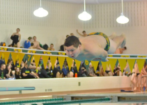 Austin Dunithan performs his final dive in Tuesday's meet with Northridge. (Photos by Nick Goralczyk)