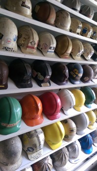 A display of protective helmets through the years.