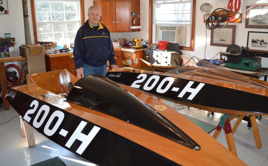 Bud Hursh with boats he is restoring