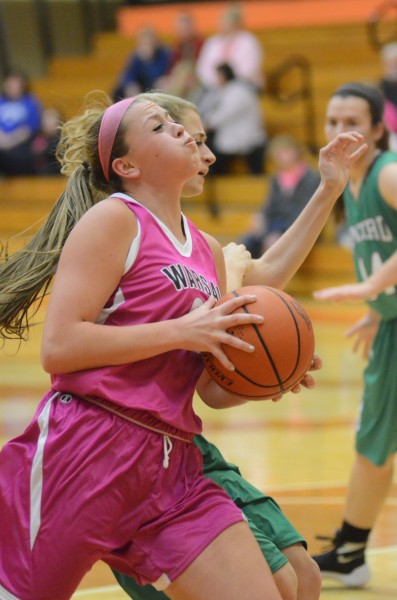 Madi Graham heads to the hoop for Warsaw Saturday night. The junior scored 16 points in an 82-38 NLC win over Concord.