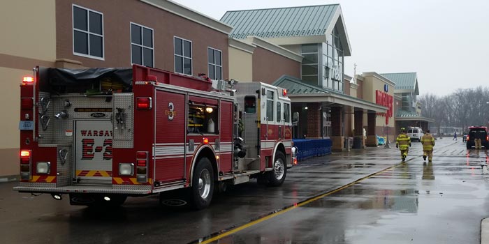 Firefighters stand by after a small fire was reported in a cooler inside the Meijer store, Warsaw. (Photo by Amanda McFarland)