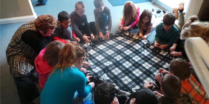Students at Warsaw Christian Schools prepare knotted blankets for Heartline Pregnancy Center. (Photo provided)