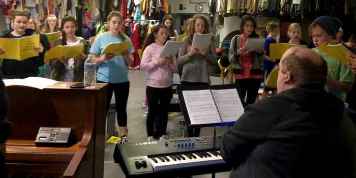 Trials of Alice in Wonderland cast rehearses with Musical Director Tom Stirling at Wagon Wheel Center for the Arts on Friday, Jan. 15. (Photo by Kira Lace Hawkins)