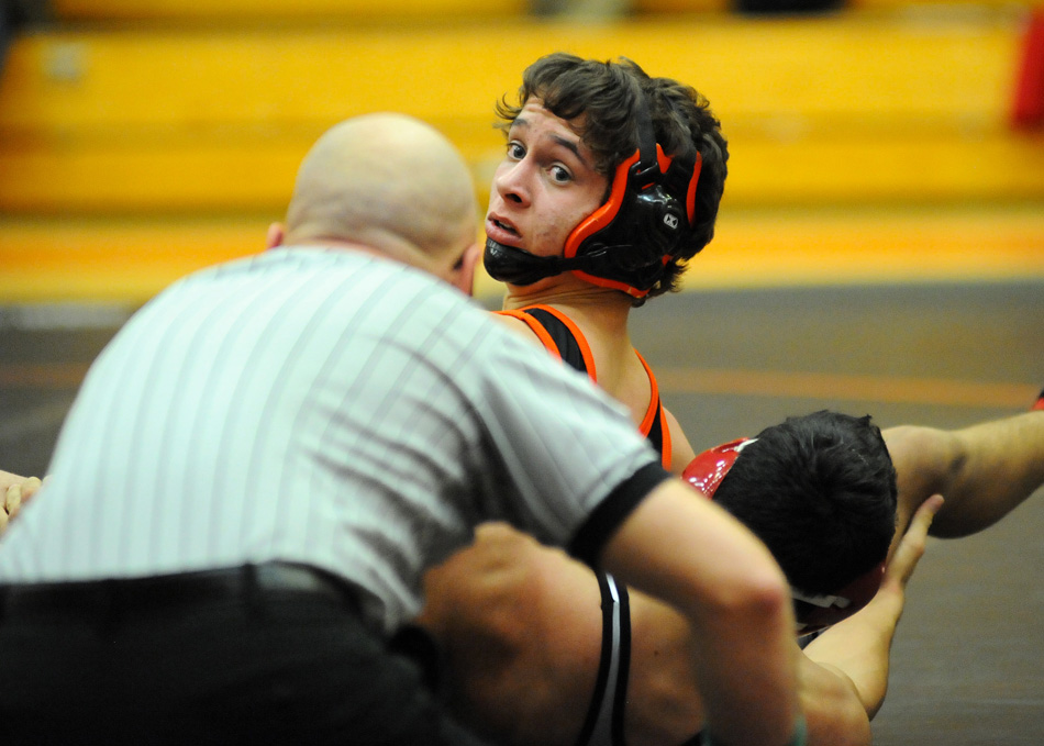 Brady Stout of Warsaw looks to the official during his matchup with Daniel Hidalgo.