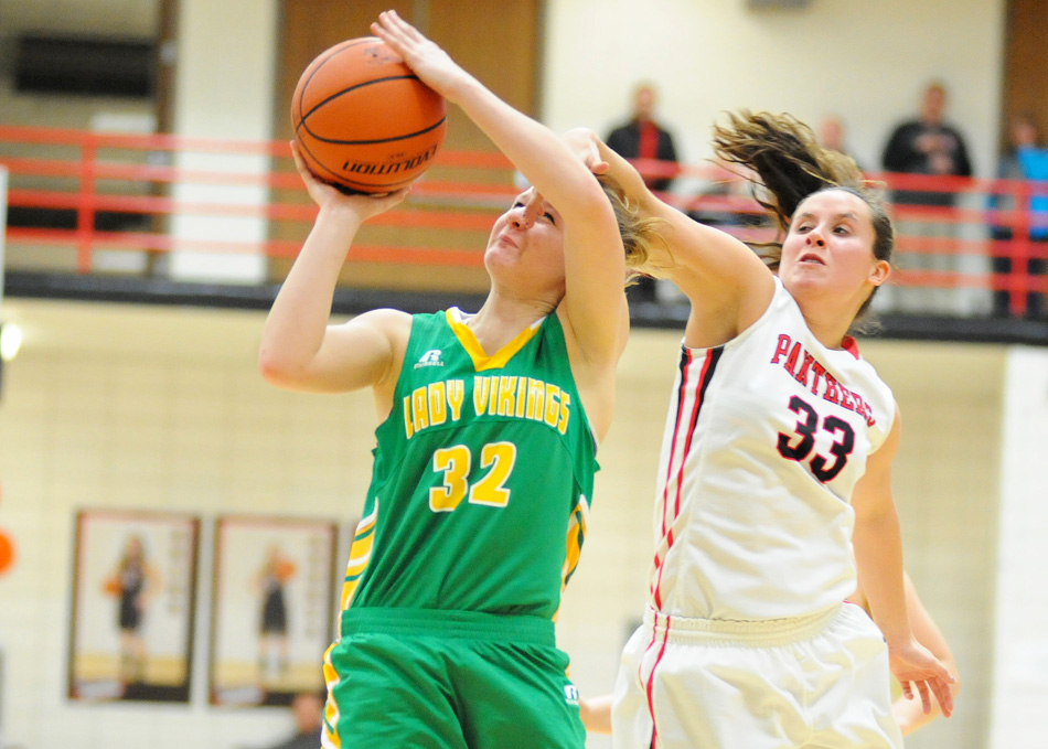 Tippecanoe Valley's Brynda Krueger has her shot contested by NorthWood's McKayla Fielstra Tuesday night. (Photos by Mike Deak)
