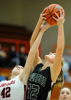 Wawasee's Hannah-Marie Lamle pulls down one of her 13 rebounds.