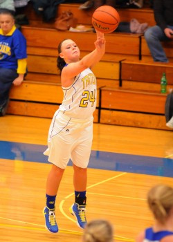 Triton senior Shayla May fires a three-point attempt in her final game at the Trojan Trench.