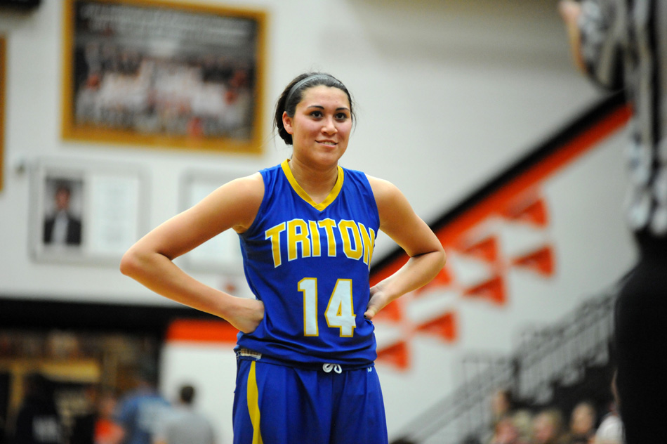 Triton's Jaela Meister was all smiles as her team clinched at least a share of the Hoosier North Athletic Conference girls basketball crown after a 66-19 win Friday night at Culver. (Photos by Mike Deak)