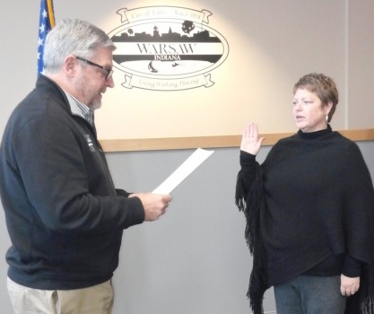 Michelle Boxell, right, takes the oath of office for a second term on the Warsaw Parks and Recreation Board from Mayor Joe Thallemer