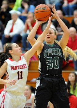 Wawasee's Kylee Rostochak fires a jumper, defended by Arika Flickinger.