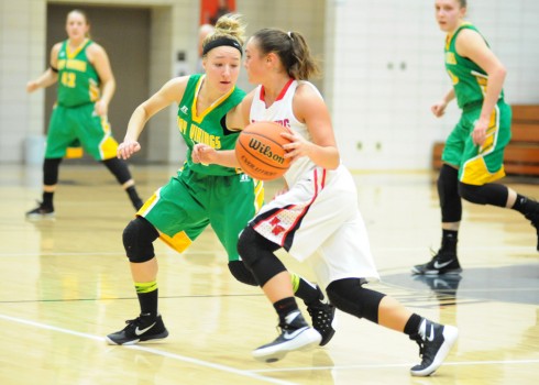 Tippecanoe Valley's Karis Tucker sticks with NorthWood's Taitlyn Trenshaw.