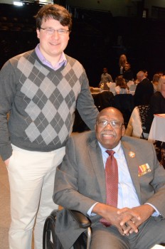 Zack Rooker, left, who, along with his family, was instrumental in bringing Charles Person, seated, to Warsaw