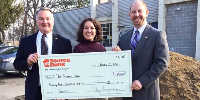 Photographed, left to right, 1st Source Regional President Bill Burton, Beaman Home Executive Director Tracie Hodson and 1st Source Warsaw City President Doug Baumgardner.